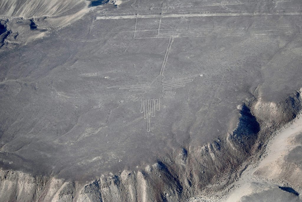 A breathtaking aerial shot of the historic Nazca Lines in the Peruvian desert, depicting ancient geoglyphs.