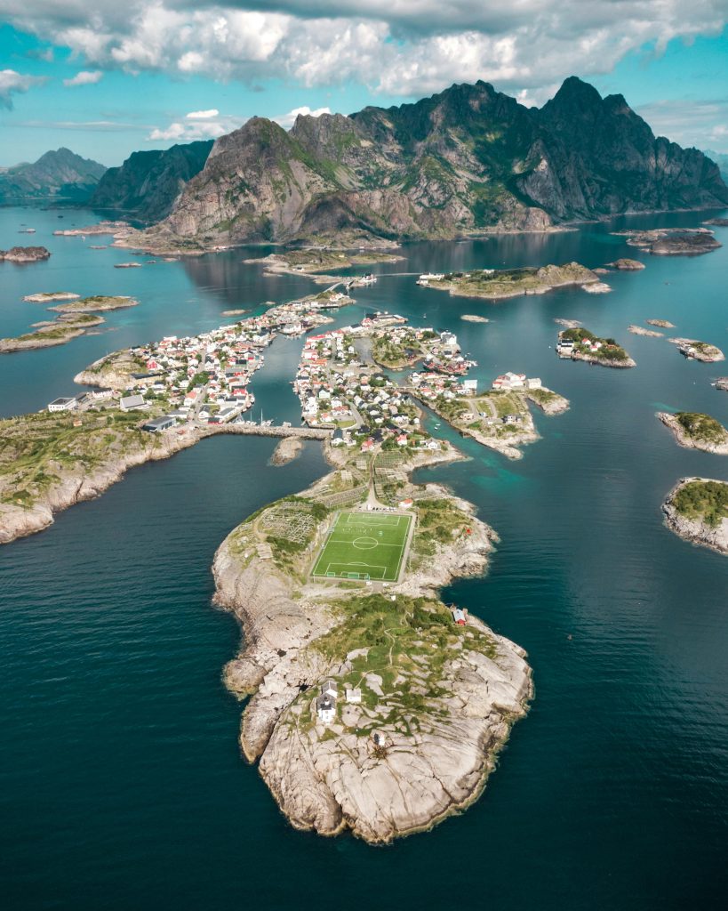 Stunning aerial shot of Henningsvær village and surrounding islands in Lofoten, Norway.